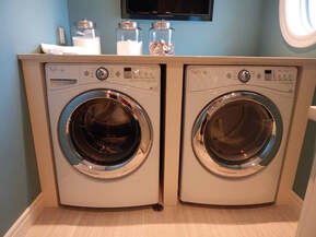 A washer and dryer in a laundry room.